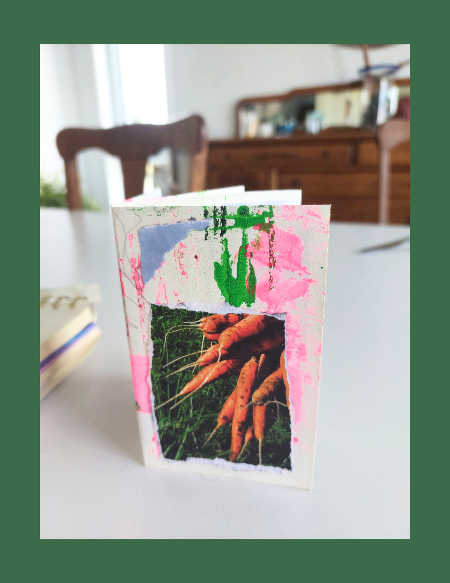 Handmade card with a picture of carrots on a table. Promotional poster for a gardening and sustainability event with cartoon carrot and crayon character on a green background. Being in the Moment, Zine Workshop, Growing Green Rockland, Sustainability 
